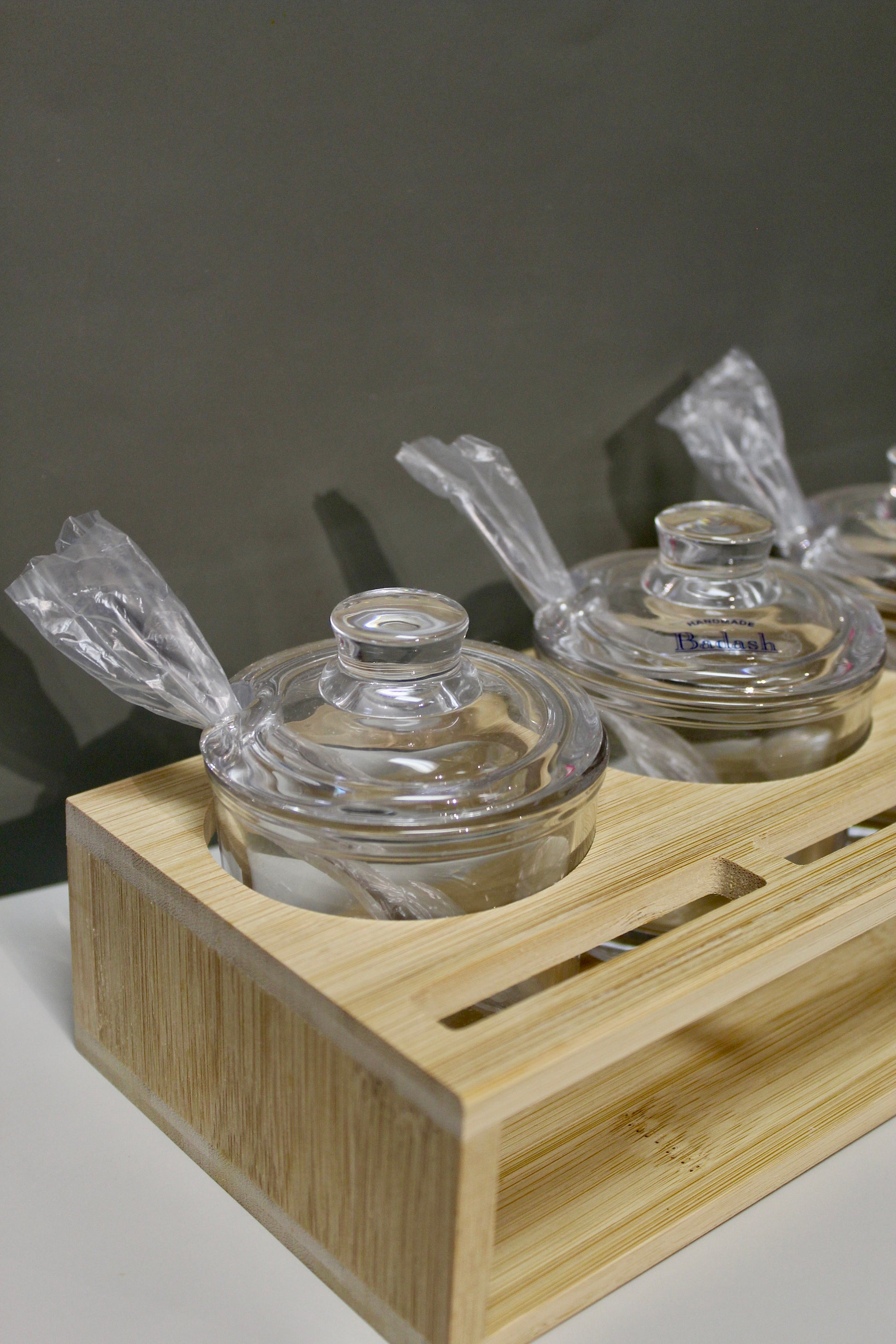 Glass Jam Set with 3 Glass Jars and Spoons On A Wood Stand